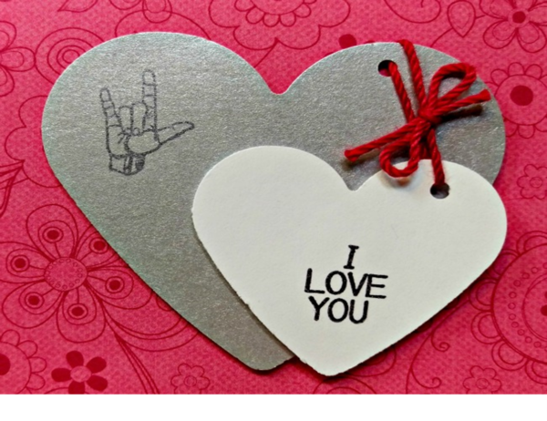 two hearts that say I Love You, one in text and one in sign language